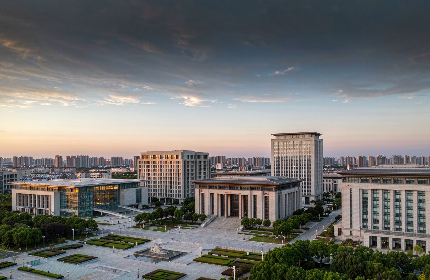 Civic district at dusk with government, hospital, university, court, museum and library buildings