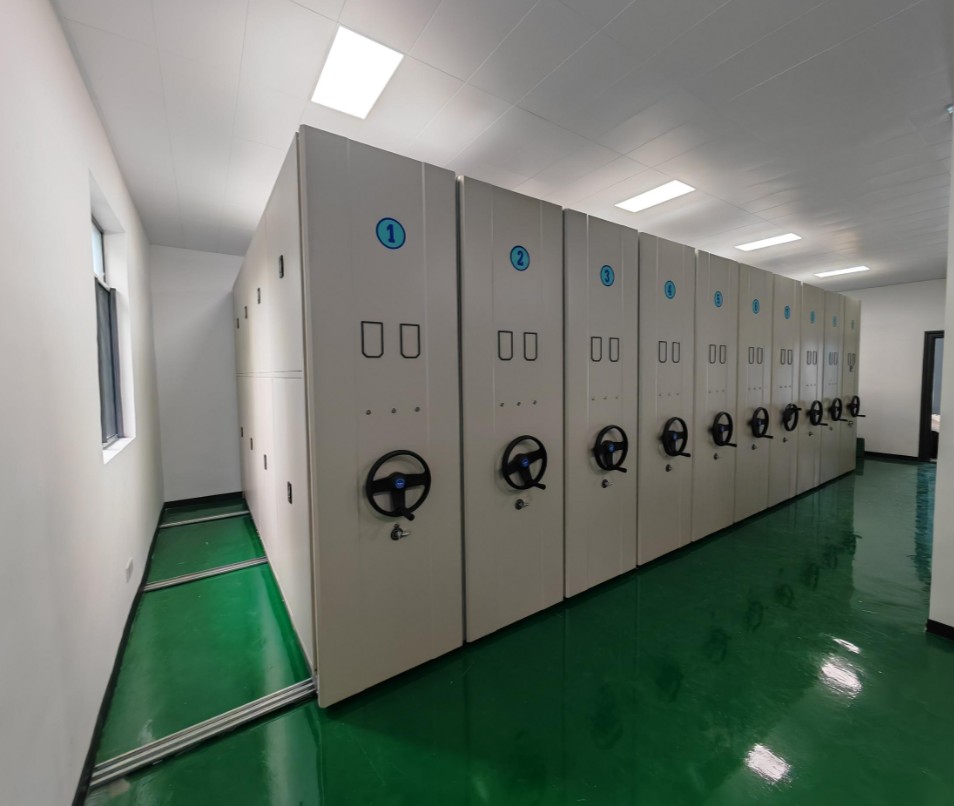 Electric compact shelving run open in a hospital records room