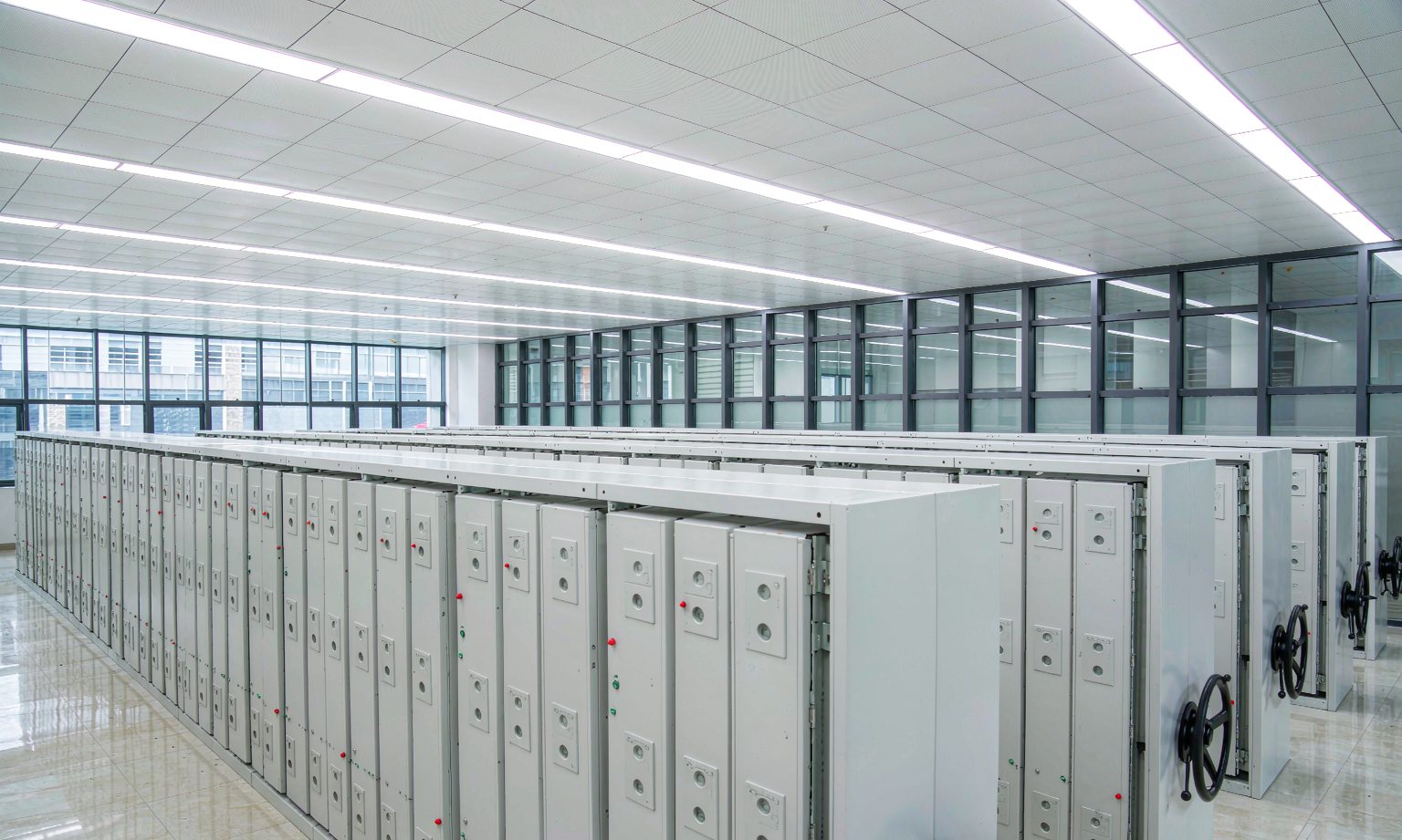 Premium corporate document center with closed mobile compact shelving runs