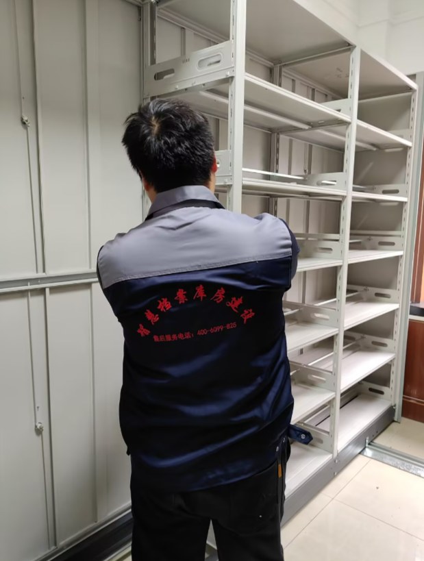 Technician assembling a compactor carriage