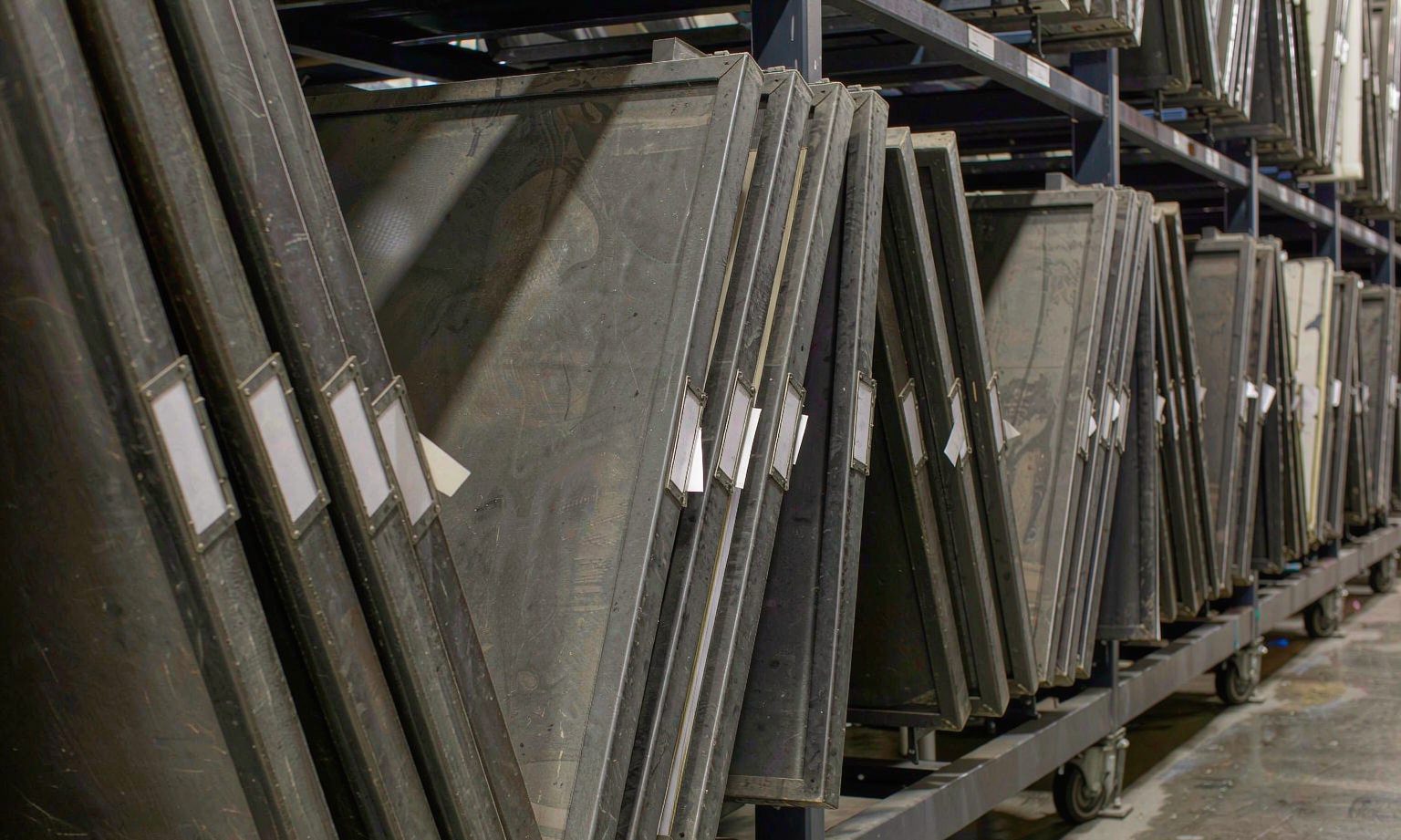 Vertical hanging drawing trays on mobile compact shelving in a technical archive