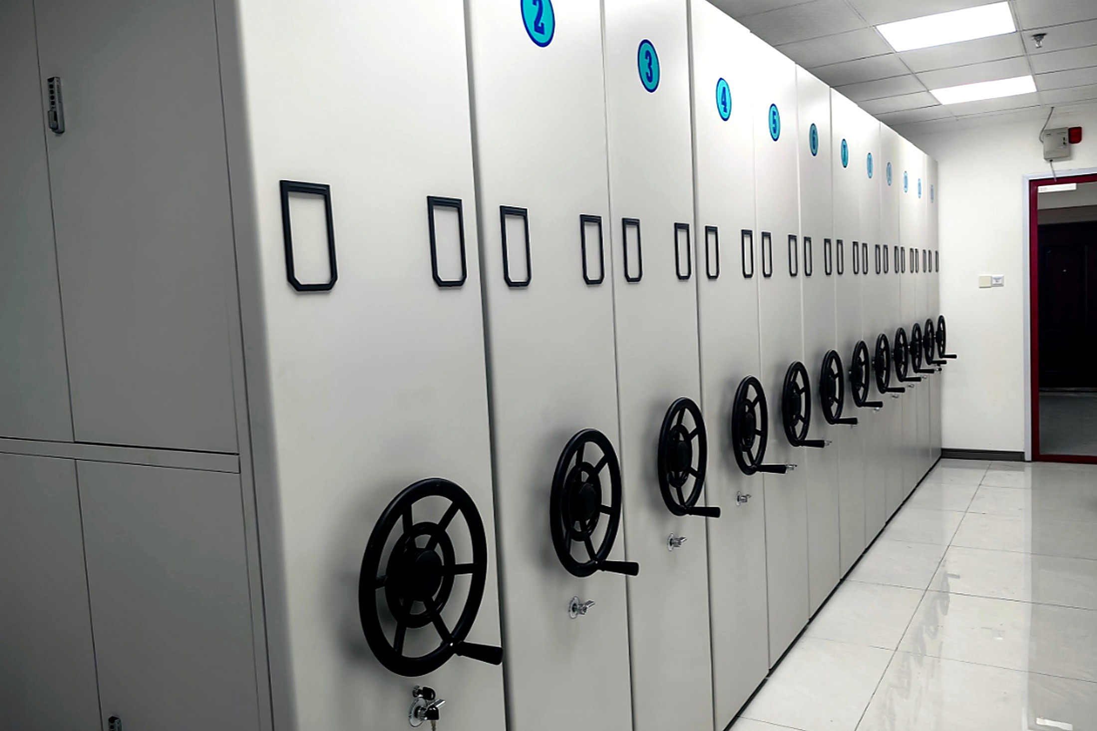 Hand-wheel mobile compactor corridor inside a records archive