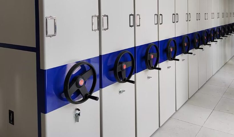 Pure manual mobile compactor shelving row with hand-wheel cranks and no electronics