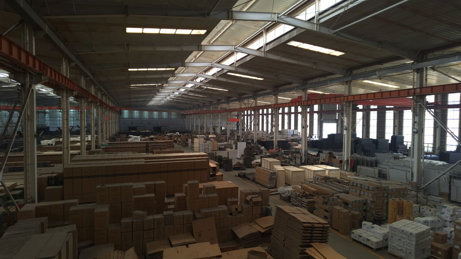 Inside the Shengmei factory workshop — steel, crates and production lines