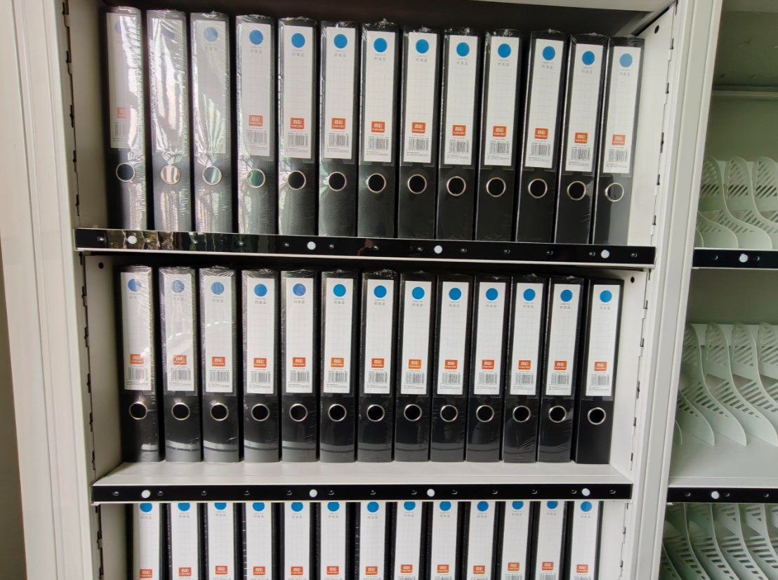 Archive boxes with RFID tags on compact shelving shelves